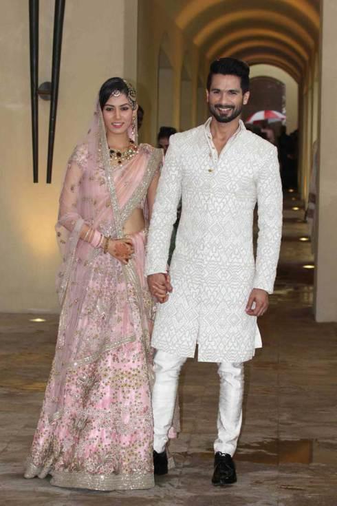 shahid-kapoor-and-mira-rajput-kapoor-first-look-at-newlyweds-baby-pink-lehenga-with-embroidered-flowers-shahid-kapoor-mira-rajput-wedding