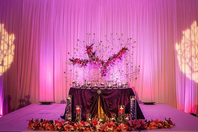 indian-wedding-reception-stage-pink-uplighting-floral-tree