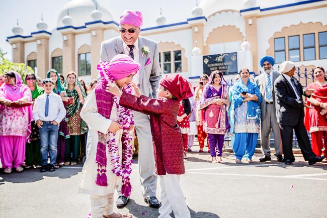 Milni between two boys outside Gurdwara