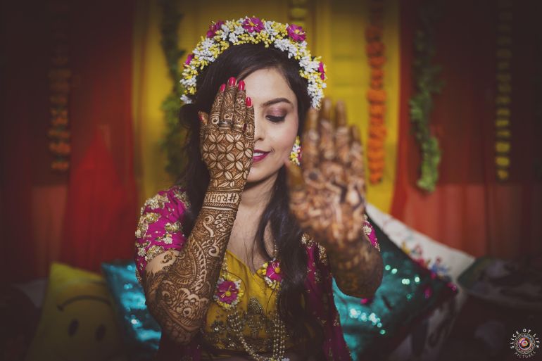 Happy Indian bride at her mehndi function. | Indian bride photography poses,  Bride photos poses, Mehndi function