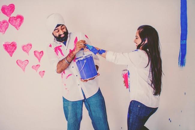 3 indian engagement shoot painting on eachother